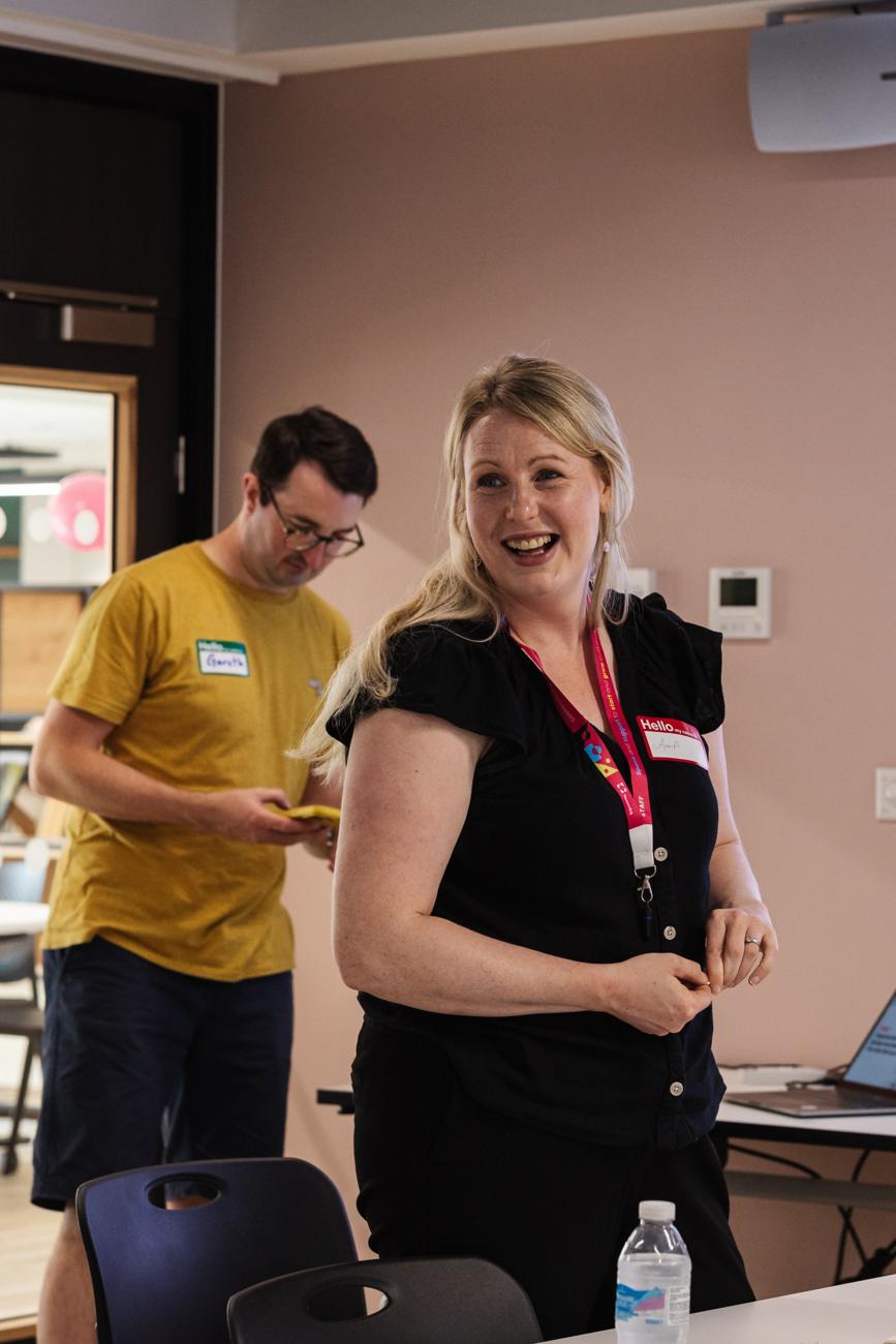 A workshop host smiling during a StartUp session